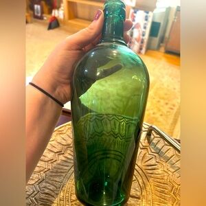 Spooky emerald Halloween decor bottle.